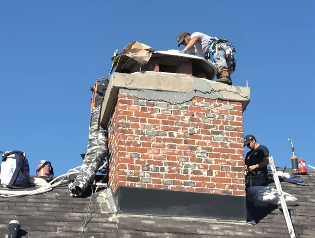 Tega Cay Chimney Sweep installing a custom chimney crown in Tega Cay, SC