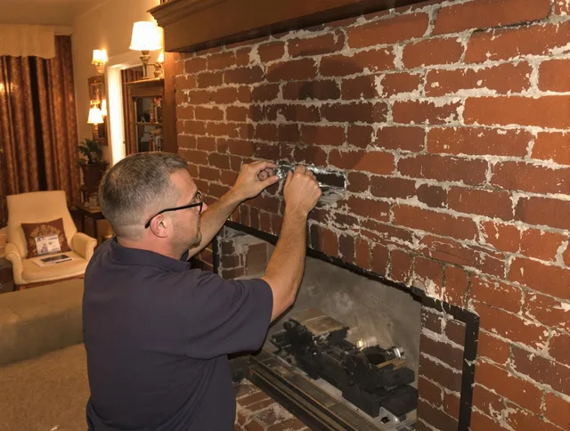 Tega Cay Chimney Sweep expert fixing a fireplace in Tega Cay, SC